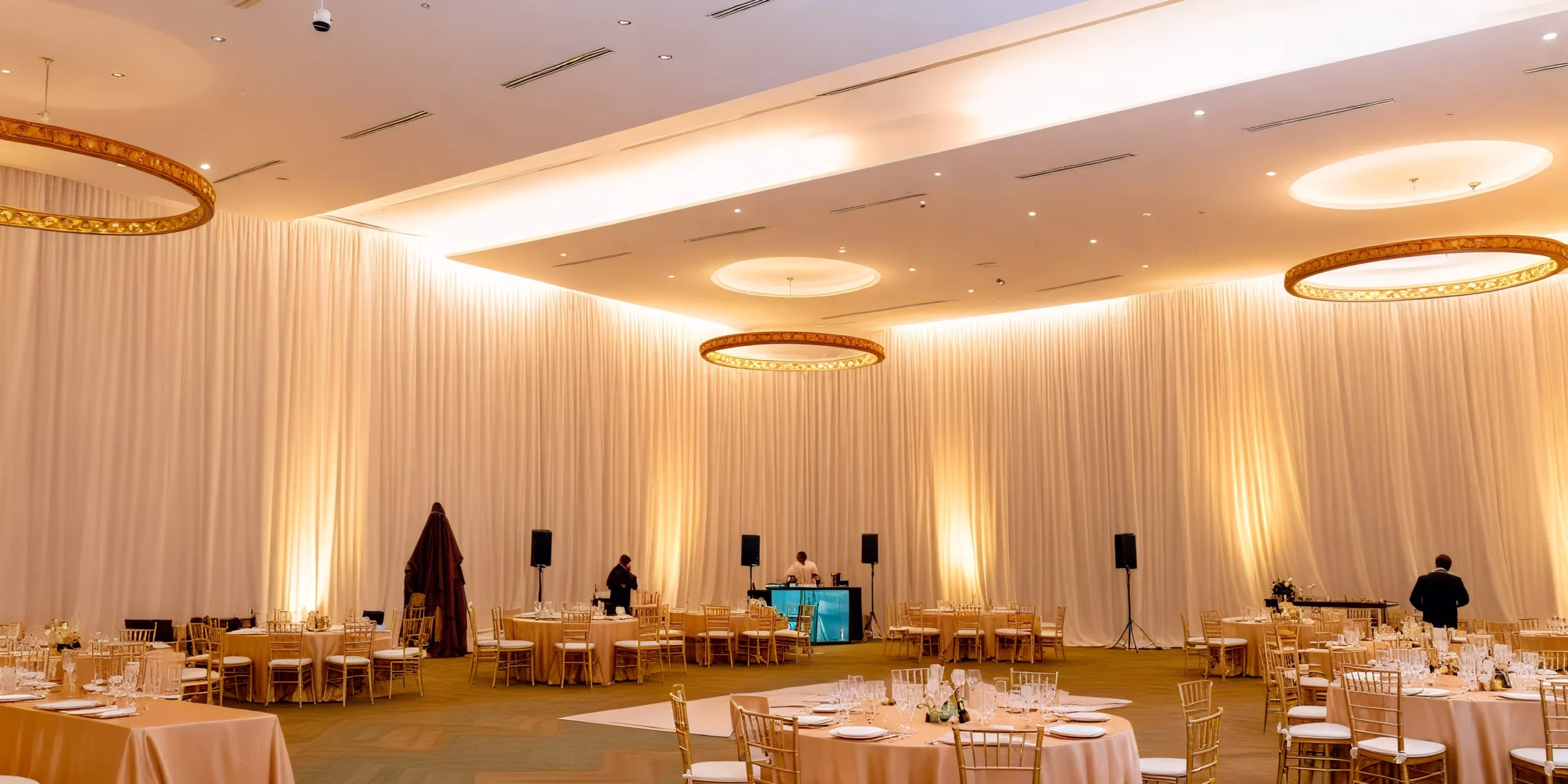 Elegant ballroom wedding reception setup with chandeliers at Dreams Playa Mujeres Golf & Spa Resort