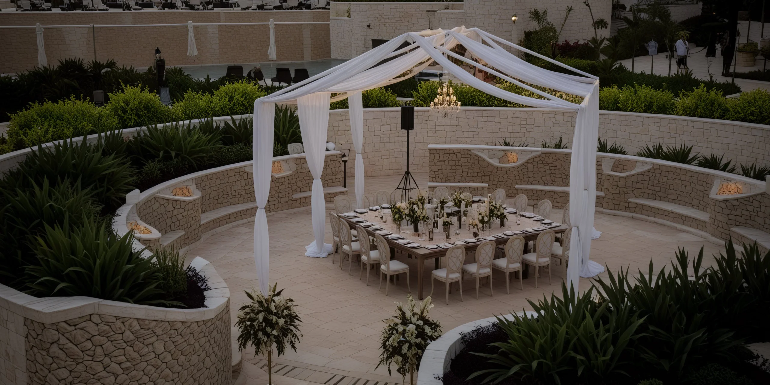 Cove Terrace intimate wedding reception with draped canopy and chandelier at Dreams Playa Mujeres Golf & Spa Resort