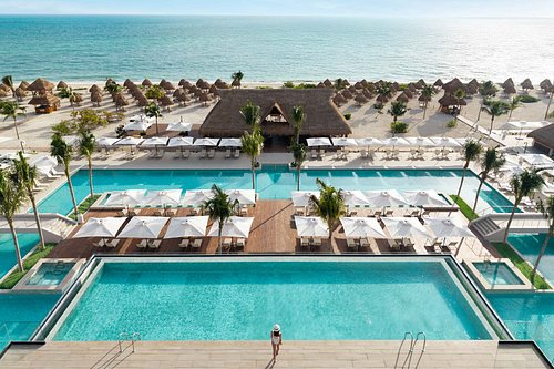 Excellence Playa Mujeres adults-only all-inclusive resort with beachfront suites and lagoon-style pools near Cancun, Mexico.