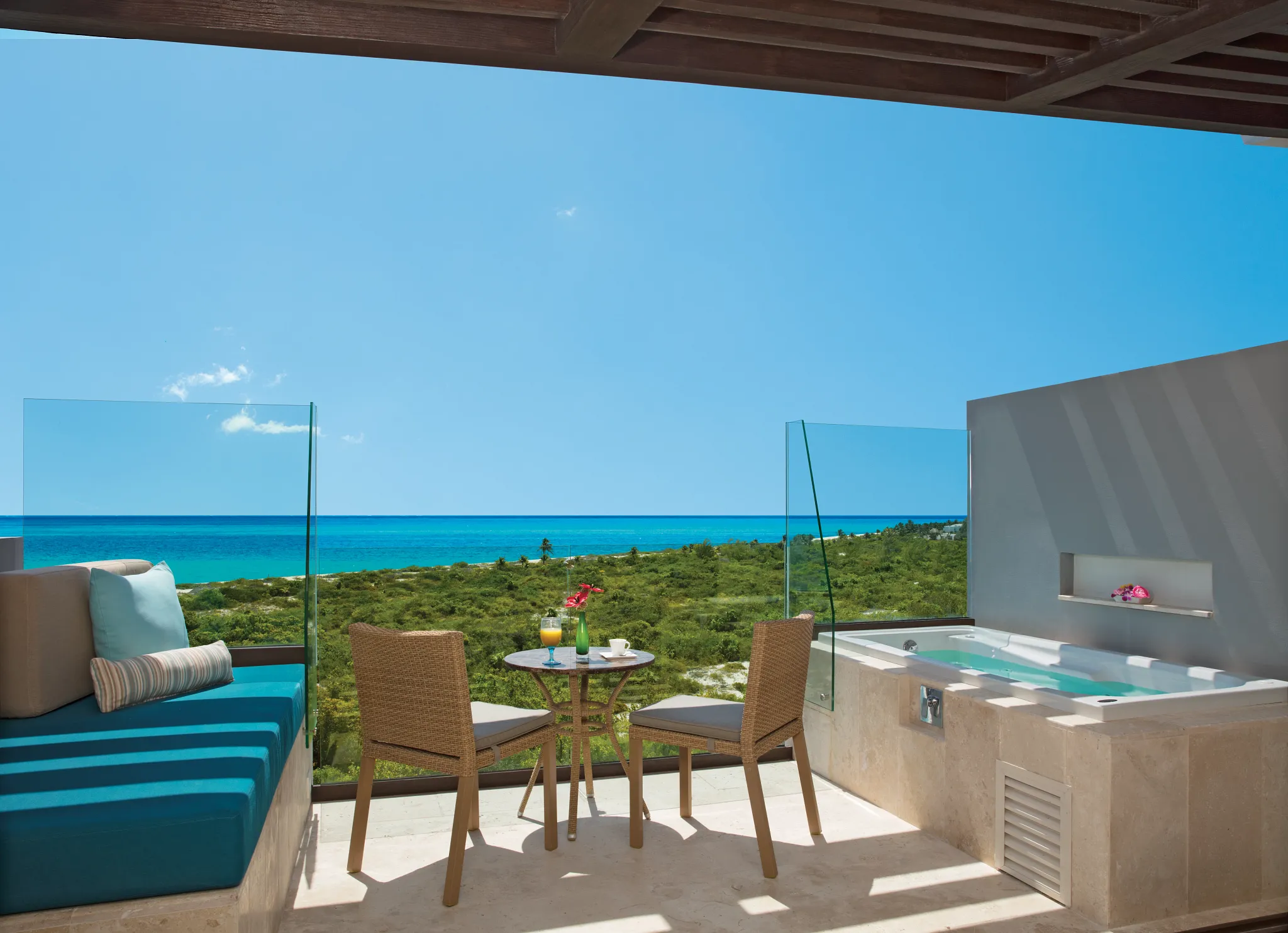 Family Junior Suite Ocean View terrace with hot tub and ocean view at Dreams Playa Mujeres Golf & Spa Resort.