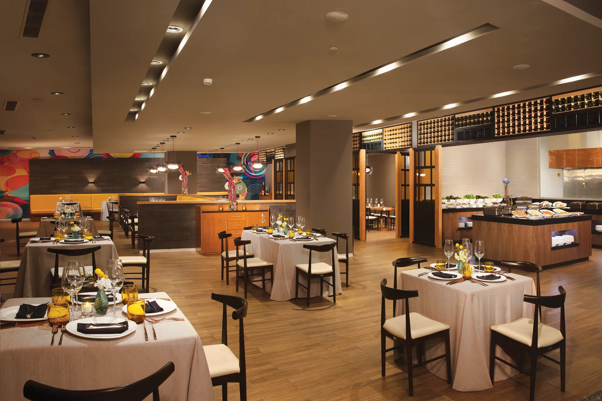 Gaucho Grill restaurant at Dreams Playa Mujeres Golf & Spa Resort featuring an elegant steakhouse setting with grilled meats and upscale dining ambiance.