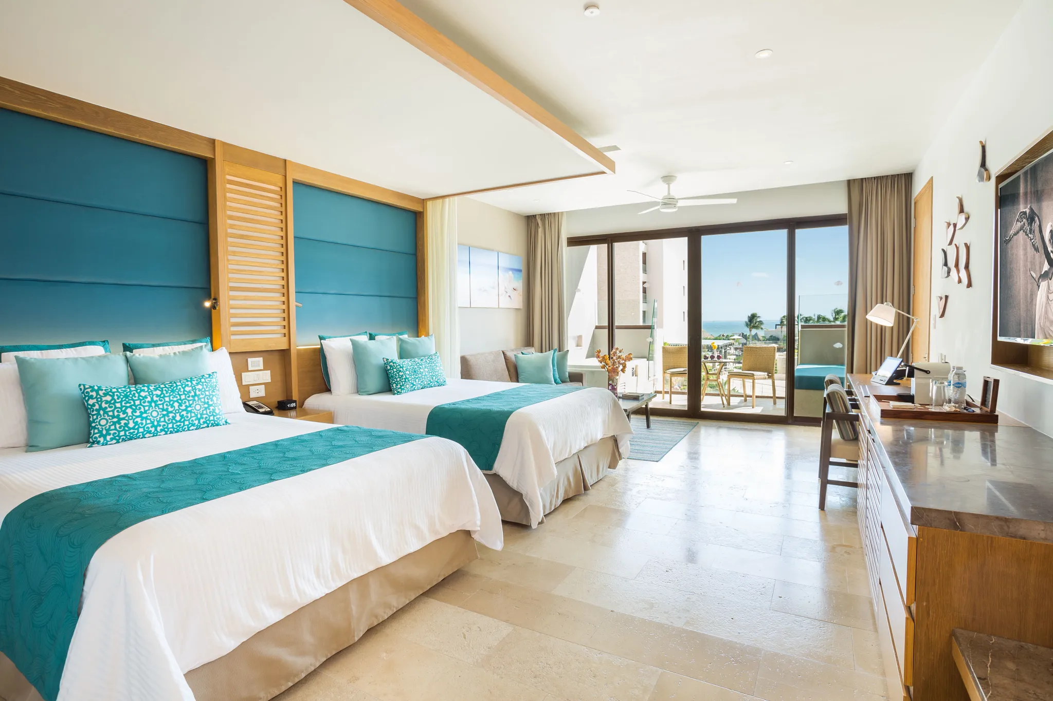 Junior Suite Partial Ocean View with two queen beds and private terrace at Dreams Playa Mujeres Golf & Spa Resort.