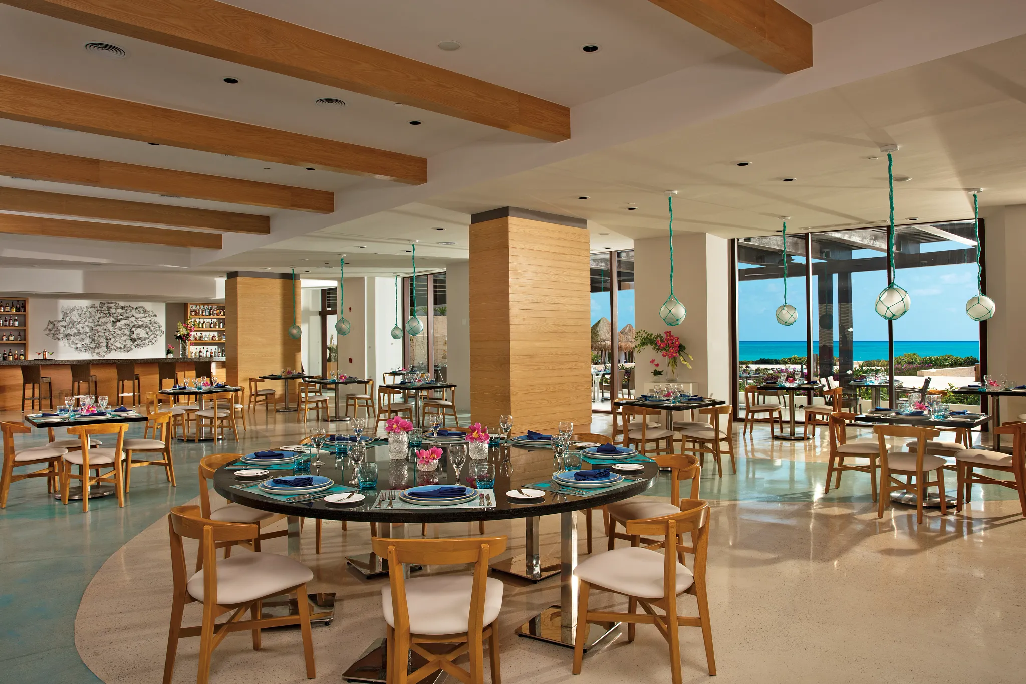 Maris seafood restaurant at Dreams Playa Mujeres Golf & Spa Resort featuring a coastal-inspired dining setting with fresh seafood and oceanfront ambiance.