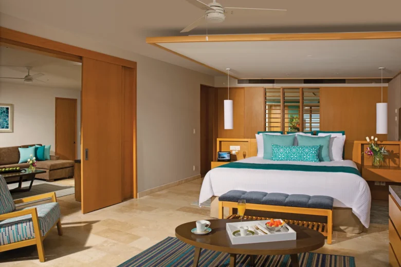 Master bedroom with king bed and sitting area in family suite.