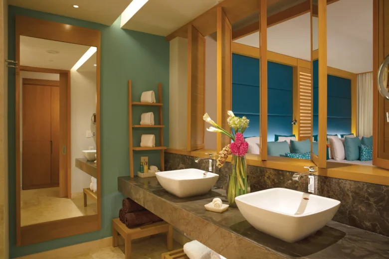 Bathroom with double vanities in Preferred Club Junior Suite Ocean Front with Private Pool at Dreams Playa Mujeres.