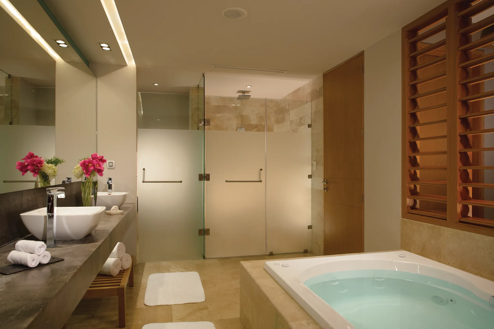 Bathroom with soaking tub and double vanities in Preferred Club Master Suite at Dreams Playa Mujeres.