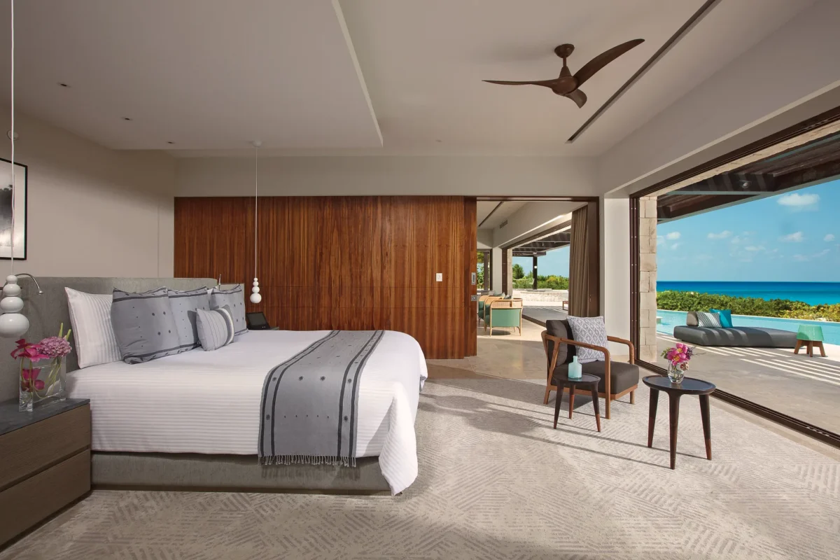 Spacious king bedroom with ocean view and terrace access.