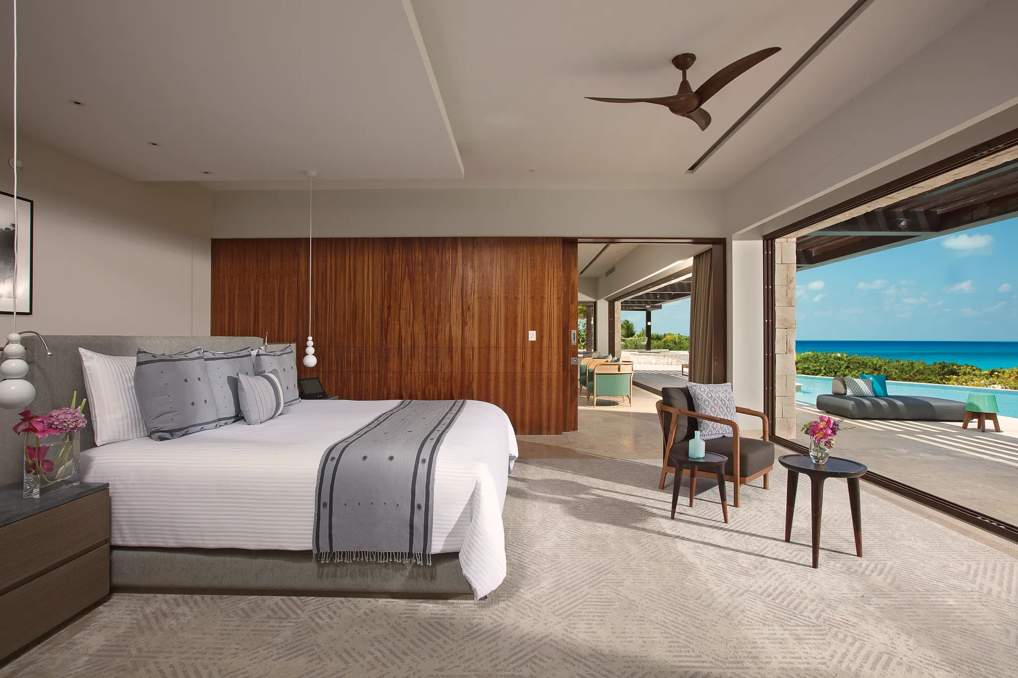 Spacious king bedroom with ocean view and terrace access.