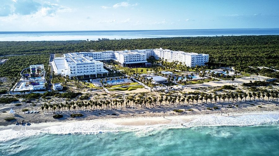 Riu Dunamar all-inclusive resort in Costa Mujeres with beachfront pools, modern architecture, and Caribbean Sea views near Cancun, Mexico.