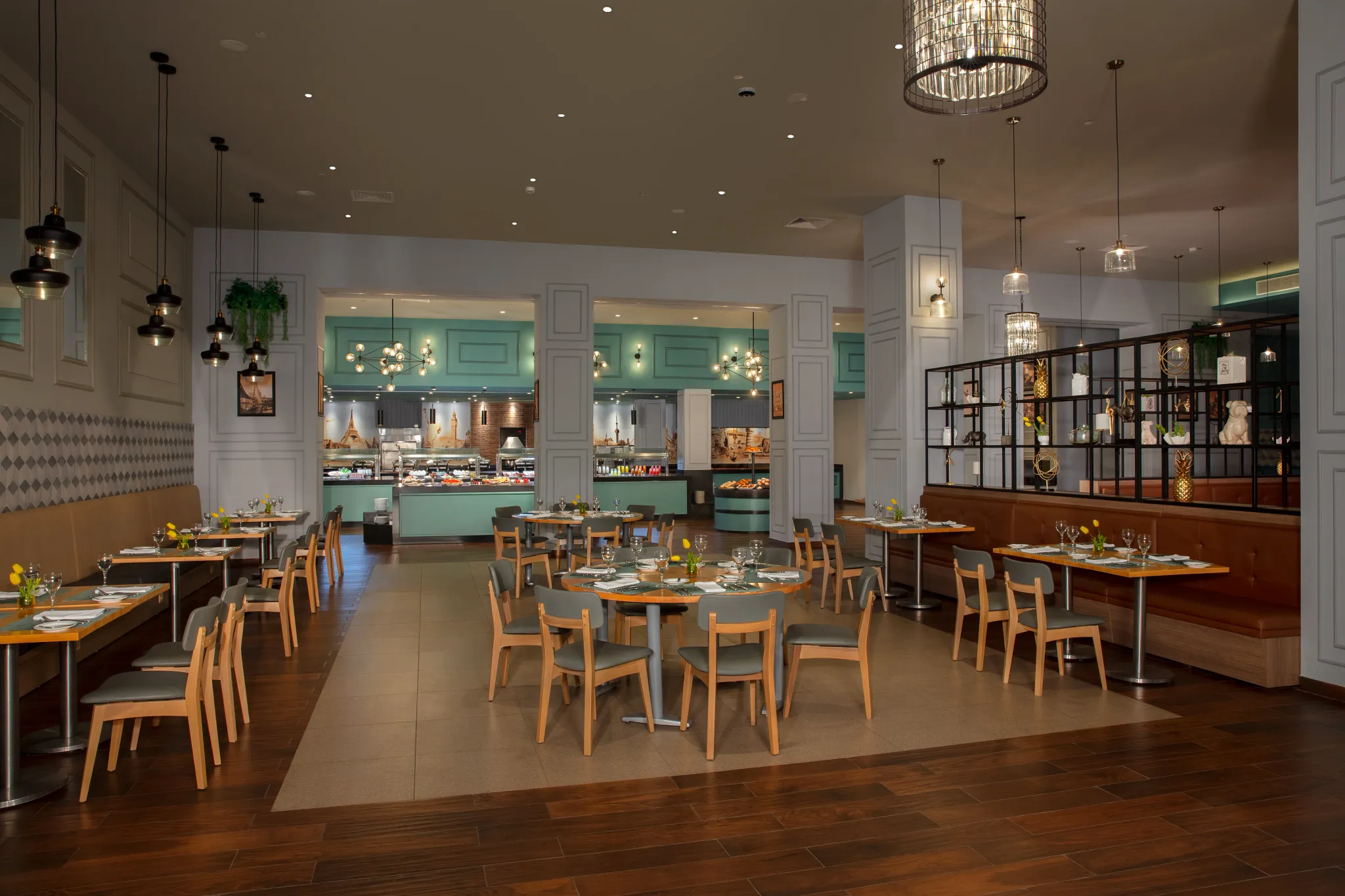World Café international buffet at Dreams Playa Mujeres Golf & Spa Resort featuring a spacious open-air dining area with global cuisine stations and modern décor.